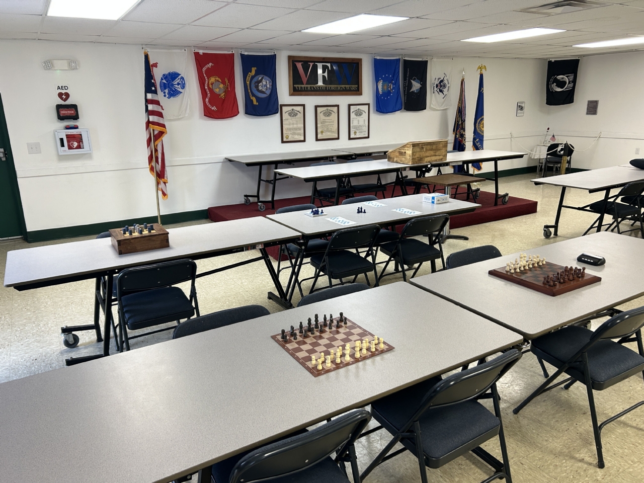 a cartoon penguin holding a sword is playing chess